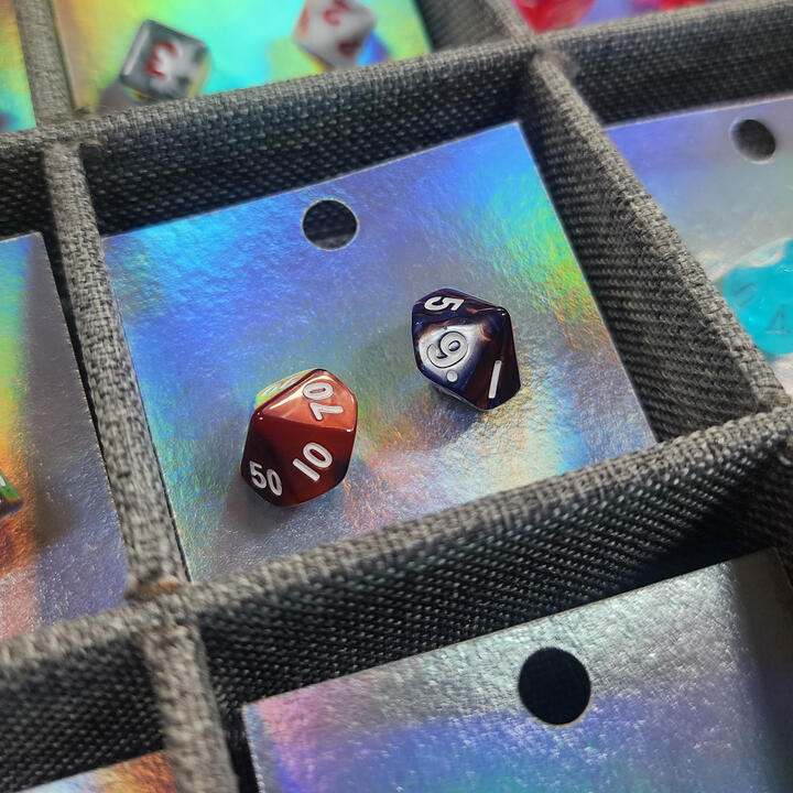 Upcycle Mini Dice Studs Red and blue d-percentile dice on a holographic card.